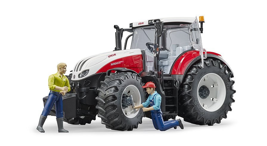 Spielszene: Reifenwechsel am Bruder Steyr Traktor mit abnehmbaren Rädern und Mechaniker