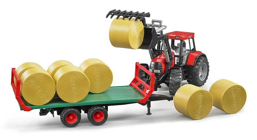 Beladung des Bruder Ballenanhängers mit einem Traktor-Frontlader