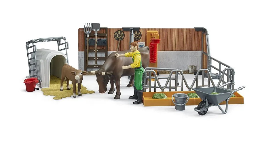 Landwirt beim Ausmisten des Stalls mit Schubkarre, Besen und Mistgabel
