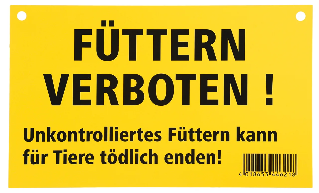 Gelbes Warnschild Füttern verboten mit Hinweis zum unkontrollierten Füttern